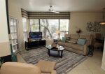 Bright and sunny living room with reclining sofa